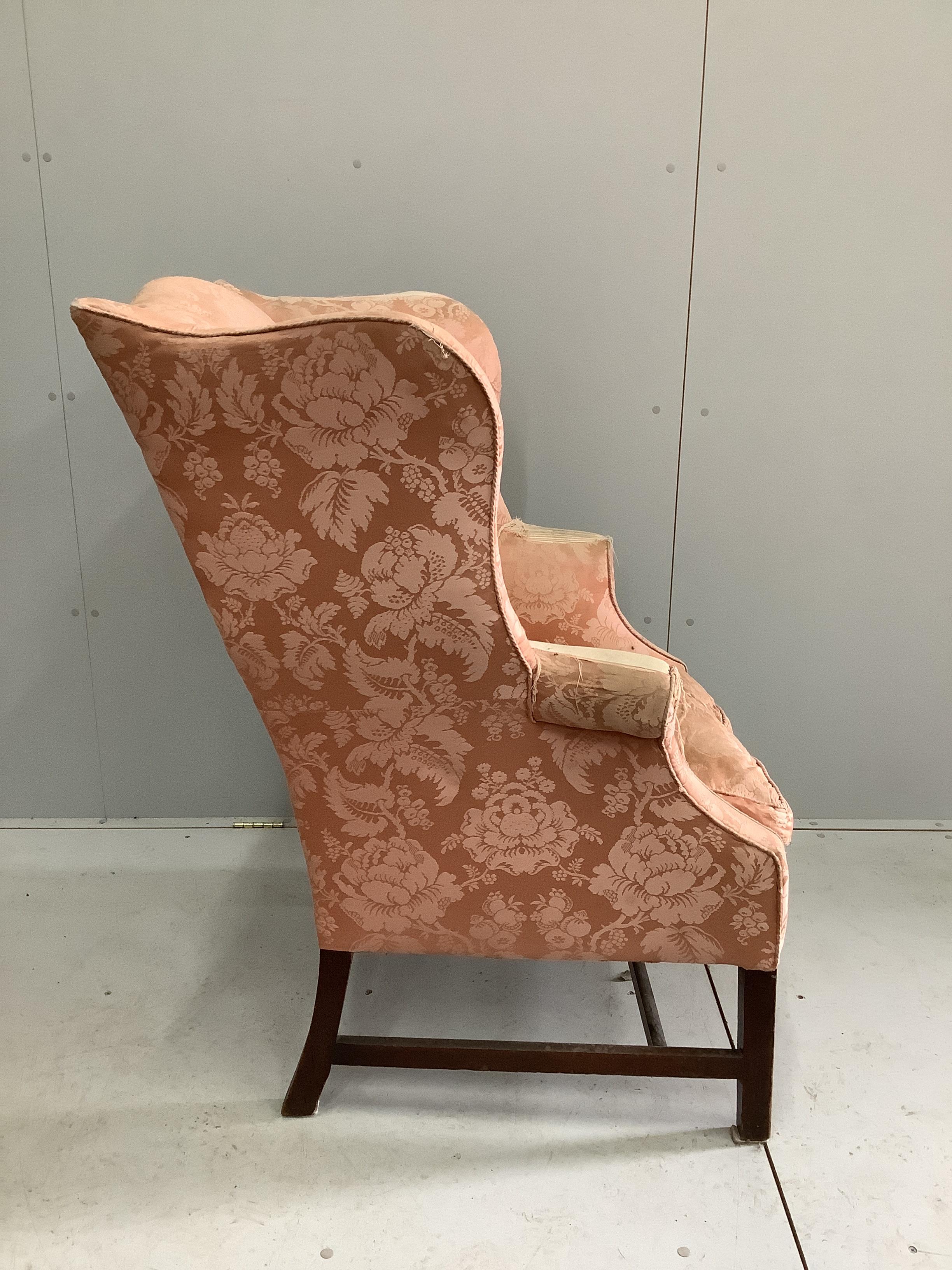 A 19th century upholstered wing armchair, width 82cm, depth 72cm, height 112cm